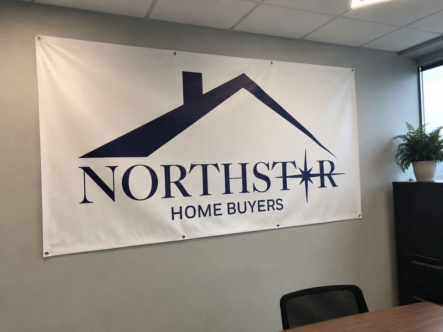 Northstar Home Buyers sign displayed in the office